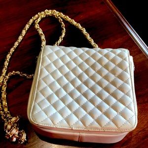 Small vegan leather bag with chain strap.